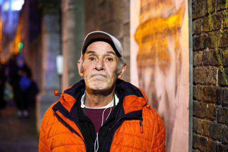 David Brown after receiving a ticket for a Christmas voucher and a bag of food at the Capuchin Day Centre. The vouchers will be distributed on the 20th December. Photograph: Alan Betson / The Irish Times