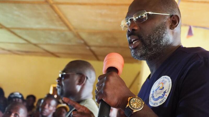 Liberian election: George Weah talks in the bush village of Todee. Photograph: Lorraine Mallinder