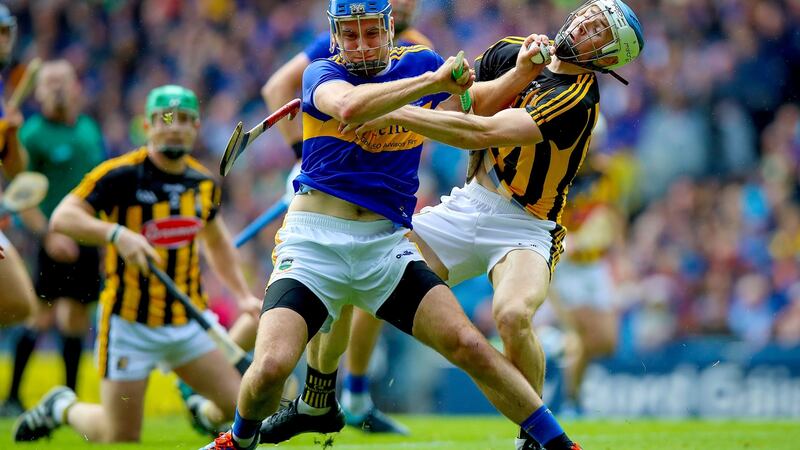 Kilkenny’s Huw Lawlor battles with John McGrath of Tipperary. Photo: Tommy Dickson/Inpho