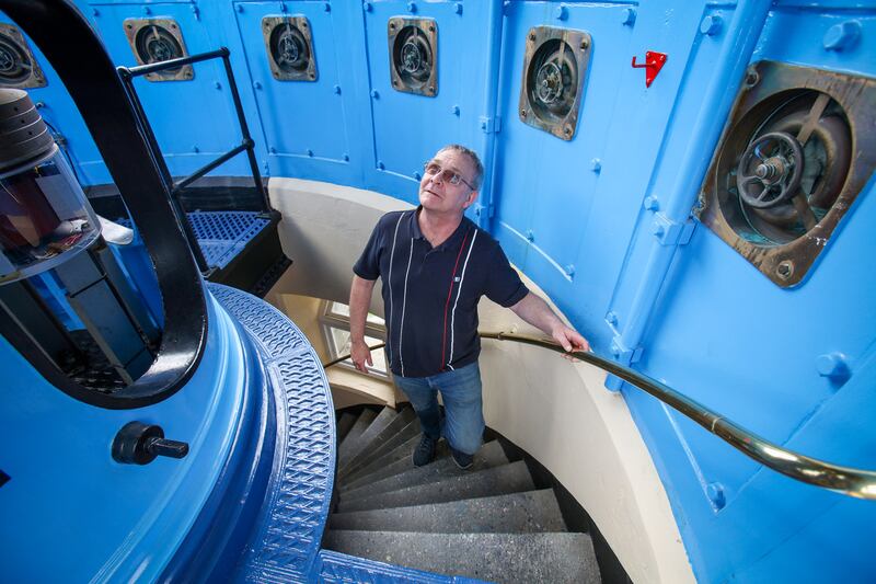 Philip Lawlor, of the Commissioners of Irish Lights, inside Blackhead Lighthouse on the east coast of Co Antrim. Photograph: Paul Faith