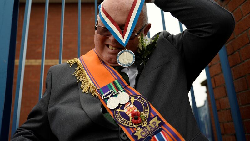 Twelfth of July: An  Orange Order member prepares to parade   through Crumlin Road in Belfast, Northern Ireland. Photograph: Clodagh Kilcoyne/Reuters