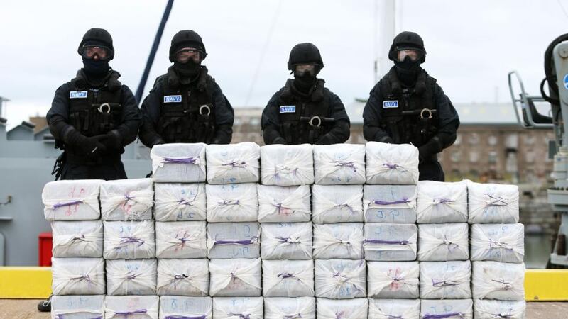 Members of the Irish Naval Service standing behind the drugs seized from the  Makayabella in September. Photograph: PA