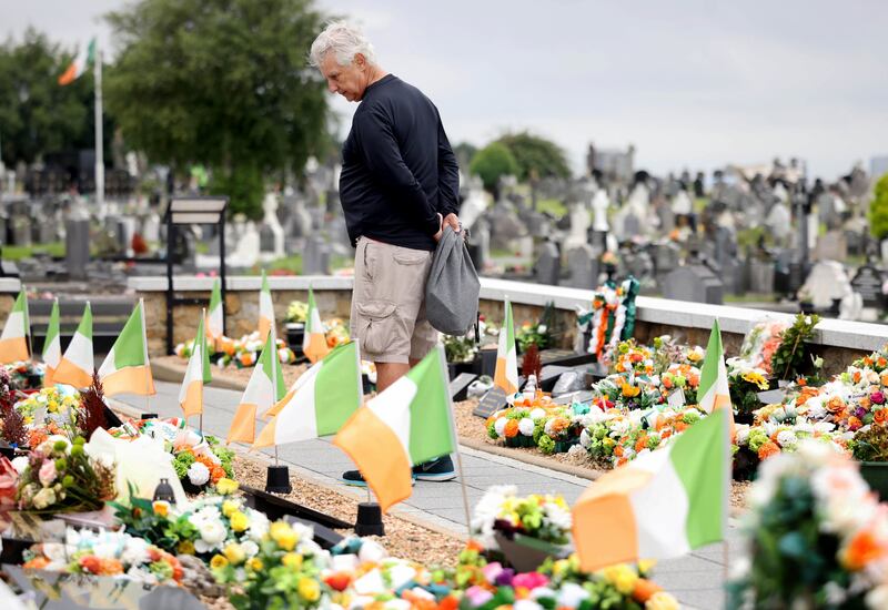 A Canadian visitor at the republican plot at Milltown Cemetery, Belfast. Photograph: Stephen Davison
