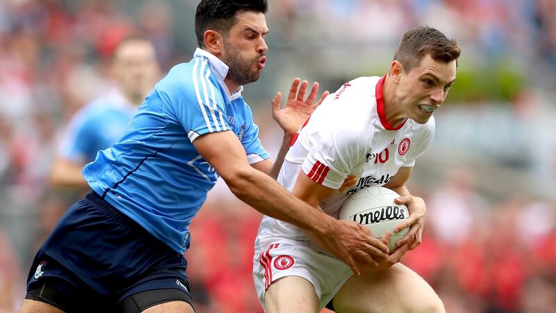 Dublin’s Cian O’Sullivan in action against and David Mulgrew of Tyrone. Photograph: James Crombie/Inpho