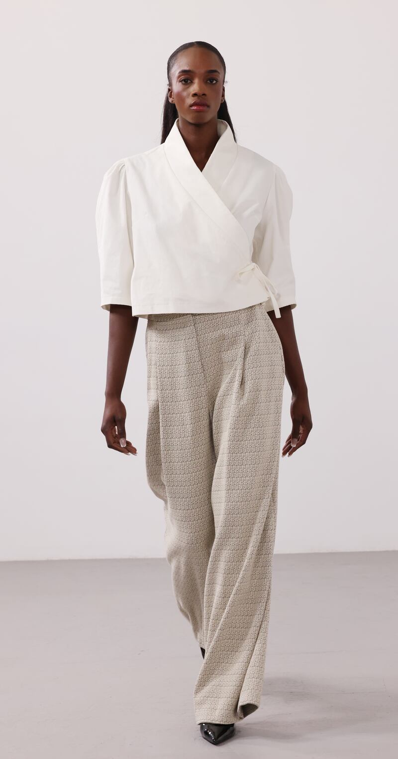 Crossed front fine corduroy cream top, €195, and pleated front jaquard trousers, €260, Silvia Ortega