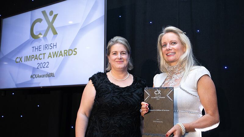 Maria Svejdar, awards judge, presents the CX Impact in Utilities & Services award to Dervla O'Flaherty, ESB Networks.