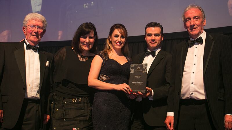 Jim Loughran, Commercial Director, Kingspan Insulation presents the Housing Project of the Year Award to  John Halligan Architects and Society of Saint Vincent De Paul team.