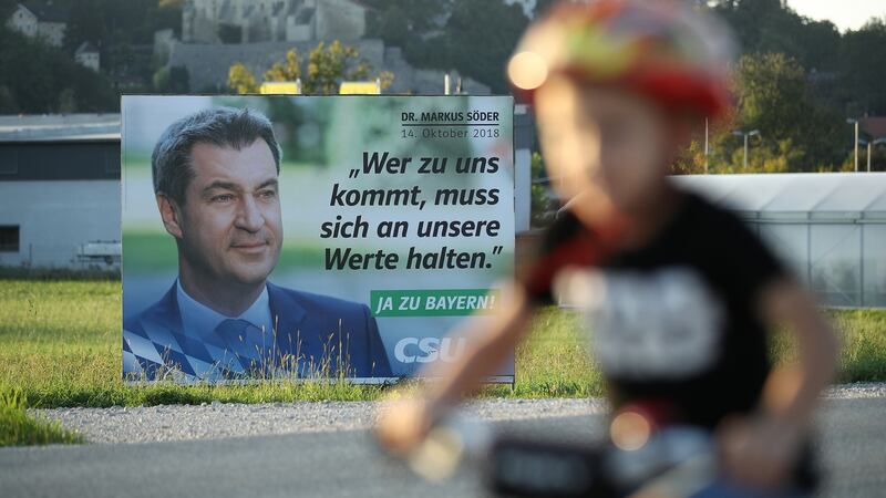 An election billboard of CSU lead candidate Markus Soeder: “Whoever comes to us [in reference to immigrants] must adhere to our values.” Photograph: Sean Gallup/Getty Images