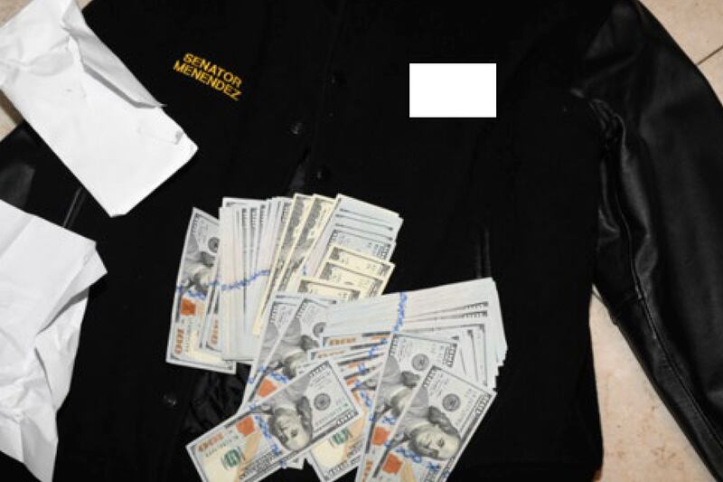 A jacket bearing Mr Menendez’s name with cash from envelopes which were found inside it. Photograph: US Attorney’s Office/AP