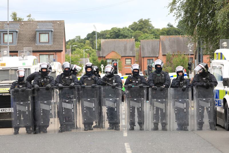 Riot police form a line on the Lower Ormeau Road last Saturday. Photograph: Peter Morrison/PA Wire 