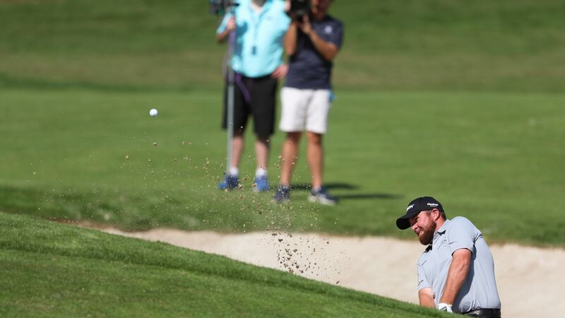 Shane Lowry hits out of a bunker. Photo: Ali Haider/EPA