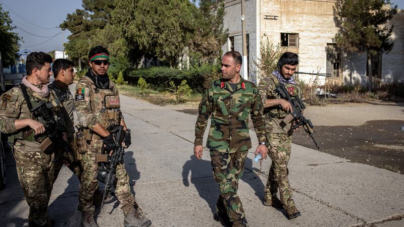 Lt Col Masoud Nijrabi (second from right) with his commandos at the cotton factory that is now their base in Kunduz, Afghanistan. Photograph: Jim Huylebroek/New York Times