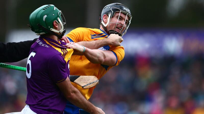 Wexford’s Shaun Murphy and Clare’s Tony Kelly scuffle during the game. Photograph: Tom O’Hanlon/Inpho
