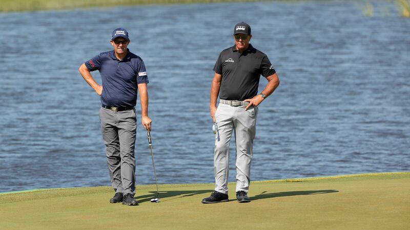 Pádraig Harrington and Phil Mickelson on the 17th green. Photo: Stacy Revere/Getty Images