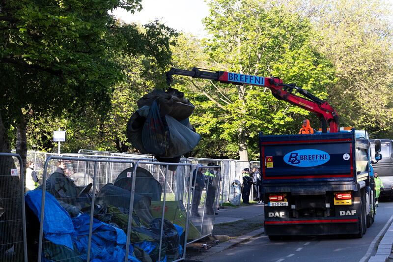 Tents erected by homeless asylum seekers being removed from along the Grand Canal in Dublin. Photograph: Sam Boal/Collins

 