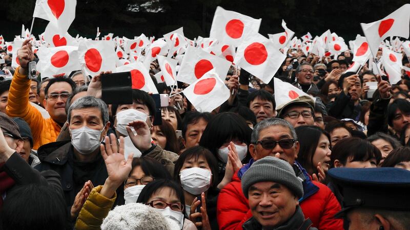 Well-wishers celebrate Emperor Akihito’s 85th birthday, his last birthday on the throne, at the Imperial Palace in Tokyo, Japan. Photograph: Kimimasa Mayama/EPA