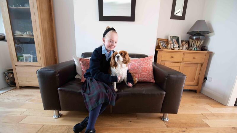 Claudia Scanlon at home with her dog: she says that some girls can be bitchy and bratty and don’t want to hang out with someone who is different. .