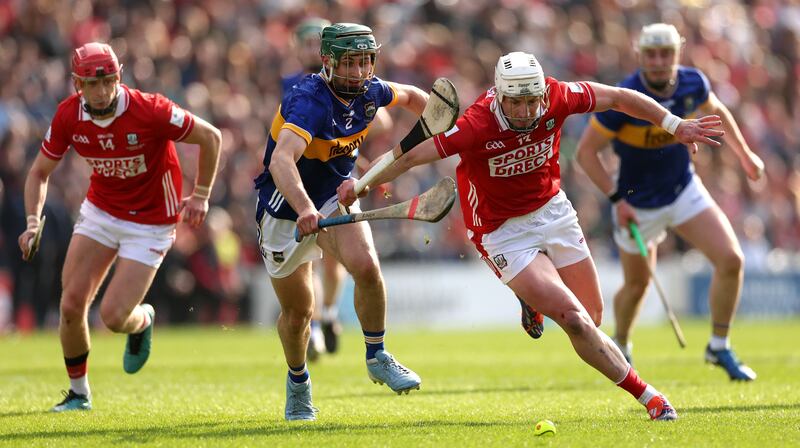 Tipperary’s Robert Doyle and Patrick Horgan of Cork chase down the sliotar during the league final at Páirc Uí Chaoimh. Photograph: James Crombie/Inpho