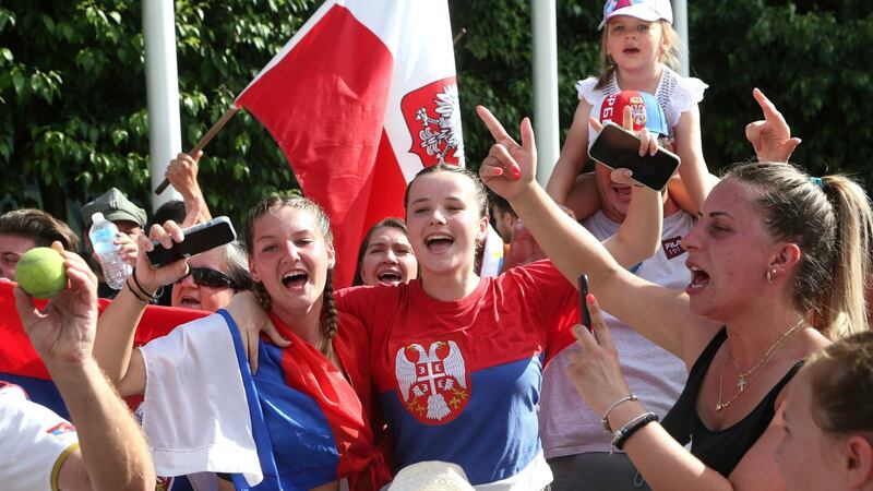 Fans celebrate Novak Djokovic’s successful appeal. Photograph: Hamish Blair/AP