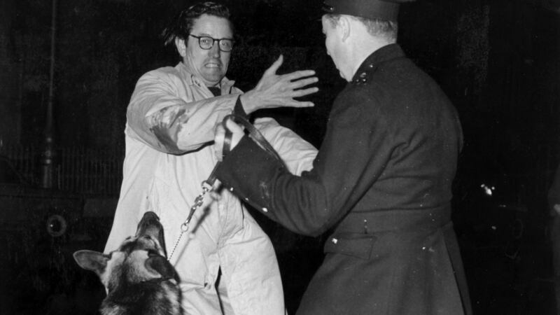 A police dog leaps to attack Dr  Noël Browne TD during demonstrations outside the American Embassy in Dublin, in 1962. Photograph: Gordon Standing