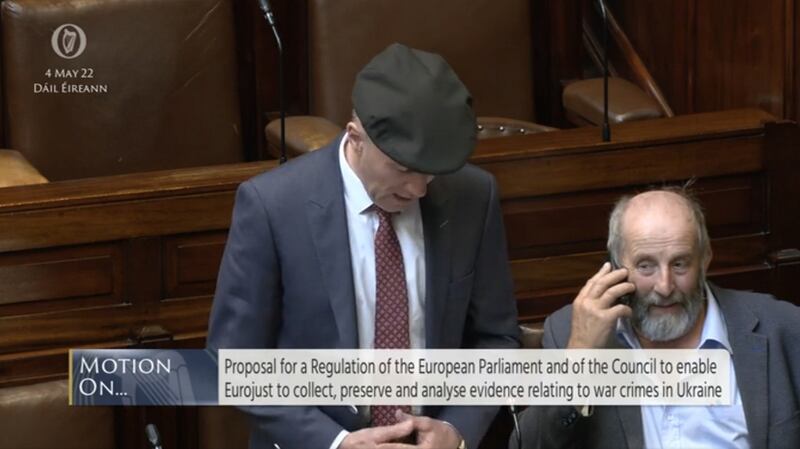 Danny Healy-Rae on his phone in the chamber during debate on Wednesday
