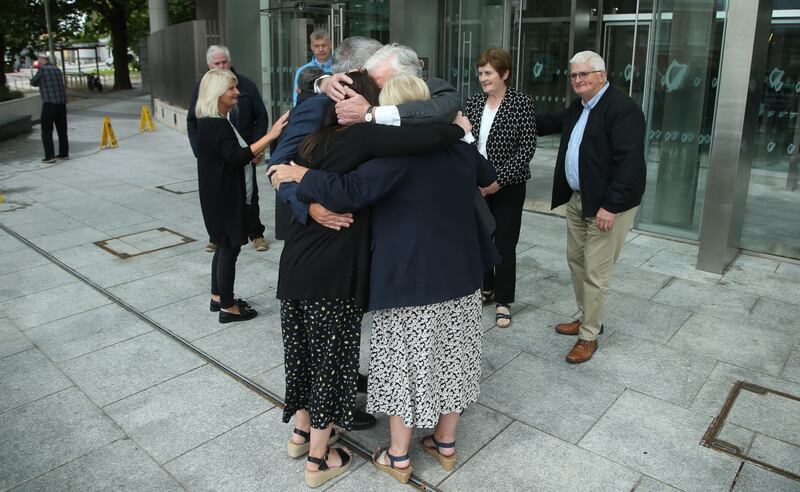 04/08/2023 
Katie Sheehan, granddaughter of Nora Sheehan, is hugged by family members James and Bernie Sheehan outside court after Noel Long's conviction. PHotograph: Collins Courts
