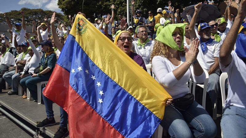 Volunteers of the movement ‘Aid and Freedom Venezuela Coalition’ attend a rally leaded by Venezuelan opposition leader and self declared acting president Juan Guaido in Caracas, on Saturday. Photograph: Yuri Cortez/AFP/Getty Images