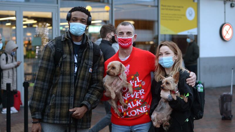 David Devlin from Clondalkin with his dogs, Archie and Cooper, at Dublin Airport with his daughter Shannen arriving from Berlin with Lou Eaongh. Photograph: Dara Mac Dónaill / The Irish Times