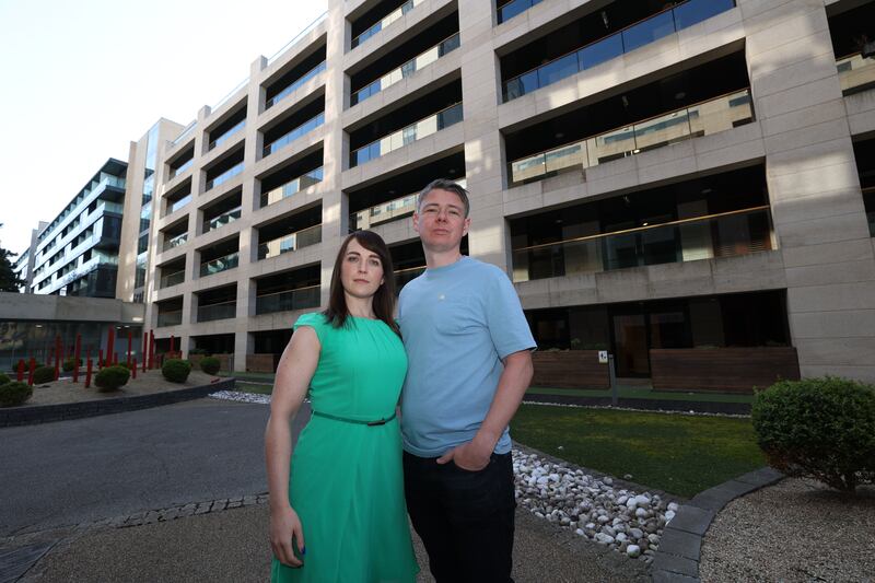 Lisa and Evan O'Shea outside the Beacon South Quarter apartment development in Dublin. 'We have the expectation now that we’re getting it, we’re making life decisions based on that fact. And if all of a sudden 20 grand was taken away again, that would be very challenging,' she says. Photograph: Nick Bradshaw
