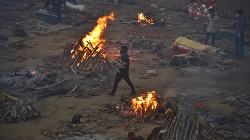 A mass funeral takes place for Covid-19 victims at a cremation ground in New Delhi, India. Photograph: Idrees Mohammed/EPA