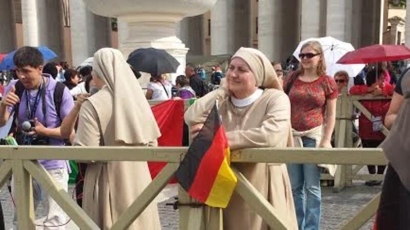 Pilgrims gather in Rome this evening ahead of ceremonies tomorrow to mark the canonisation of Popes John XXIII and John Paul II. Photograph: Patsy McGarry.