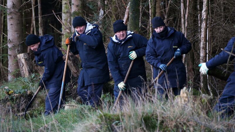 Gardaí search  woodland  off  Green Road in the townsland of Rosenallis, Co Laois,  during a renewed search for the remains of Fiona Pender, December 2014. File photograph:  Colin Keegan/Collins Dublin