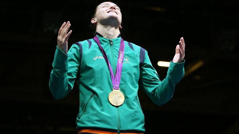 Katie Taylor takes in the moment during the medal ceremony. Photograph: Dan Sheridan/Inpho