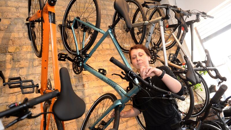 Anne Bedos working in the Rothar bike shop in Phibsboro, Dublin. Photograph: Dara Mac Dónaill/The Irish Times