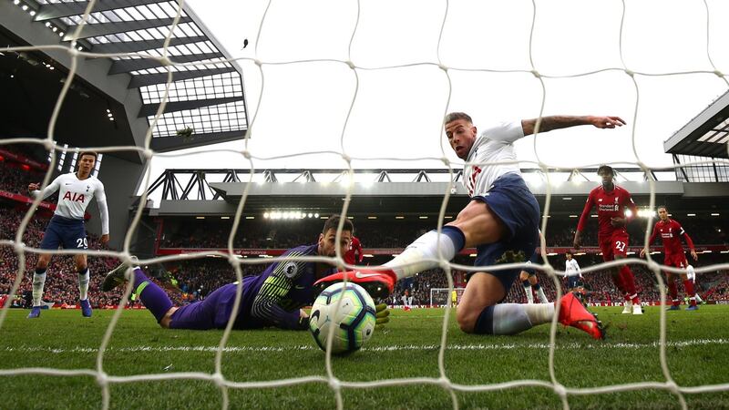 Tottenham Hotspur’s Toby Alderweireld scores an own goal after a late Hugo Lloris error against Liverpool at Anfield. Photograph: Clive Brunskill/Getty Images