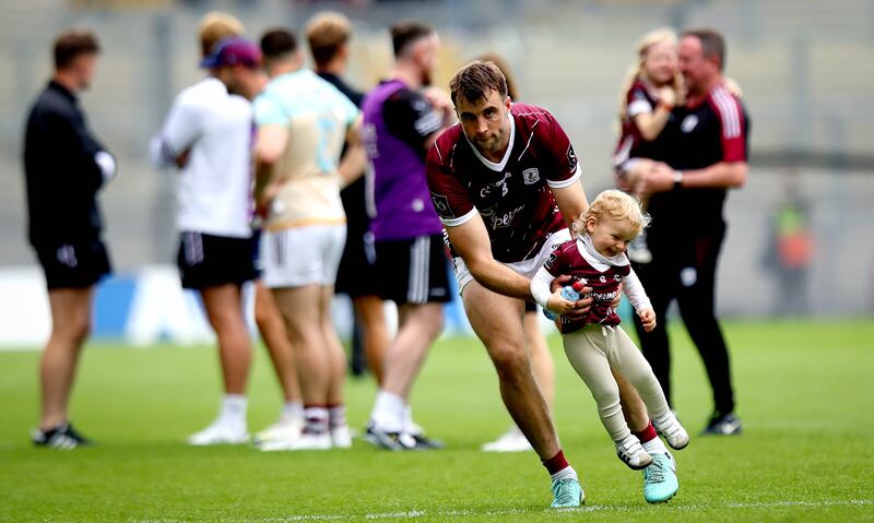 Galway’s Paul Conroy with his son Paídí at Croke Park. Photograph: 
Ryan Byrne/Inpho