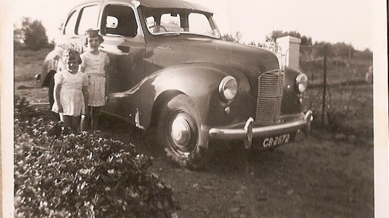 Betty with her sister Patricia and their family's new Austin A40 in South Africa