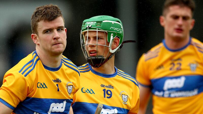 Clare’s Tony Kelly, Gary Cooney and Conor Cleary dejected after the game.  Photograph: James Crombie/Inpho