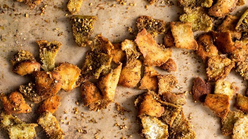 Chunks of pita bread, tossed with za’atar for flavour. Photograph: Andrew Scrivani/The New York Times