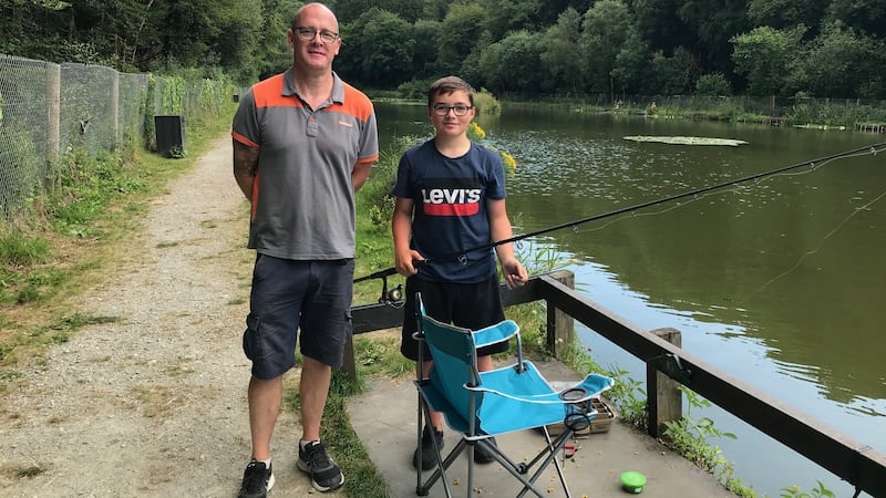 Oaklands Coarse Fishery proprietor, Adrian Browne assisting Kian Ferguson, aged 13, at the lakeside in New Ross, Co Wexford