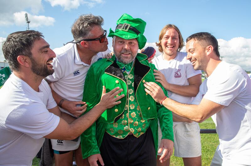 Players from the Mara XV from Argentina rub Stephen Joseph from the Swansea Gladiators for luck ahead. Photograph: Tom Maher/Inpho