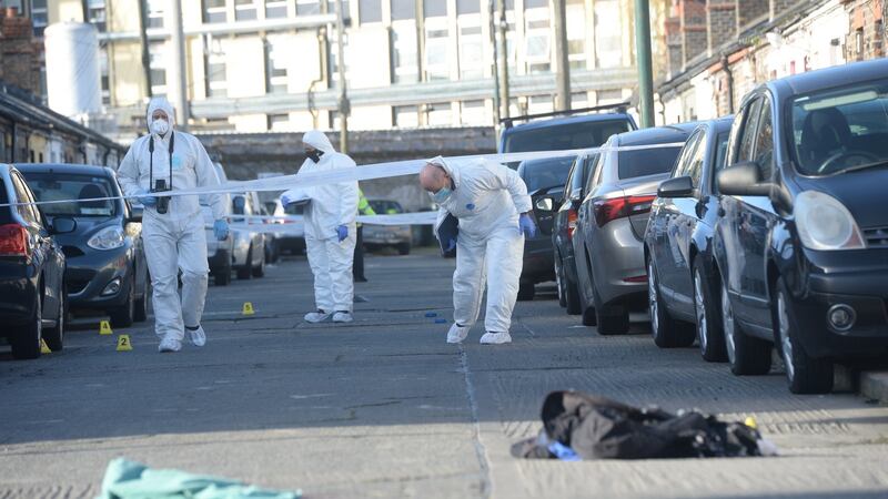 Garda investigators on Thursday morning at the scene of a shooting that happened on Wednesday night on Eugene Street in Dublin’s inner city. Photograph: Dara Mac Donaill