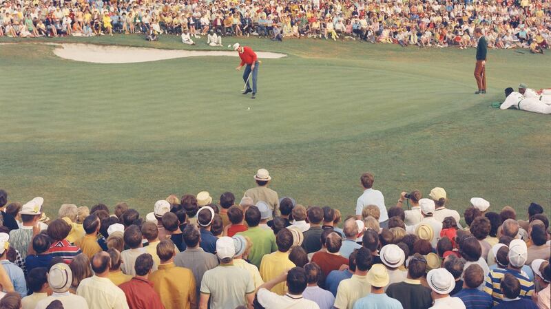 Archer putts on the 18th hole to win. Photo: Augusta National/Getty Images