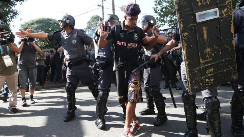 Police respond to a World Cup protest outside Carrao Metro Station in Sao Paulo today ahead of the opening game this evening. Photograph: Mario Tama/Getty Images