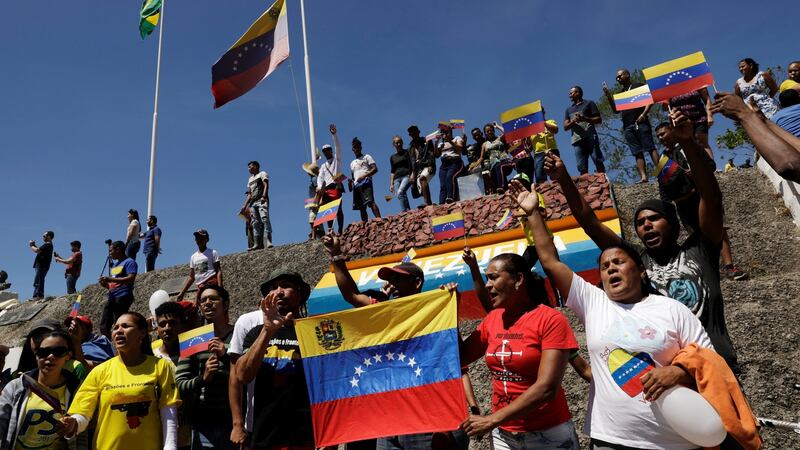 People gather at the border between Venezuela and Brazil in Pacaraima, Roraima state, Brazil. Photograph: Ricardo Moraes/Reuters