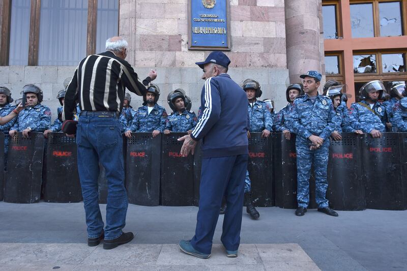 A man gesturing towards Armenian policemen in Yerevan during a protest against Azerbaijan's military action in Nagorno-Karabakh. Photograph: EPA-EFE