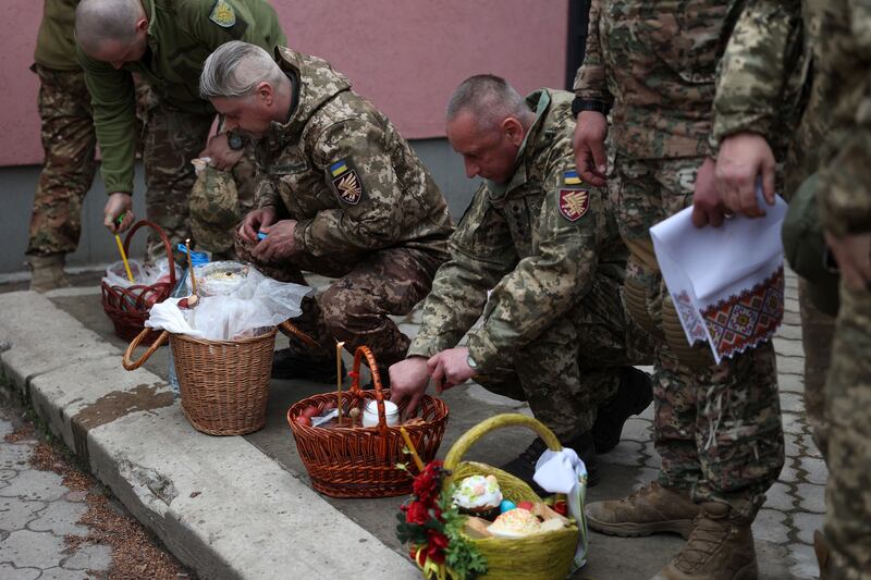 Ukrainian soldiers attend a church service on the eve of Orthodox Easter, in the eastern Ukrainian city of Sloviansk. Photograph: Anatolii Stepanov/AFP