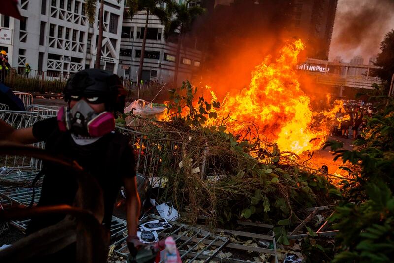 A fire lit by protesters burn in the Sha Tin district of Hong Kong. Photograph:  Isaac Lawrence / AFP
