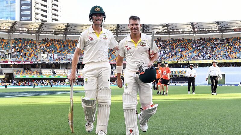 Australian openers Cameron Bancroft (L) and David Warner leave the field at stumps. Photograph: Dave Hunt/EPA