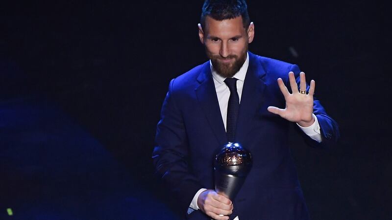 Argentina and Barcelona forward Lionel Messi reacts after winning the Fifa player of the year award in Milan. Photograph: Marco Bertorello/AFP/Getty Images